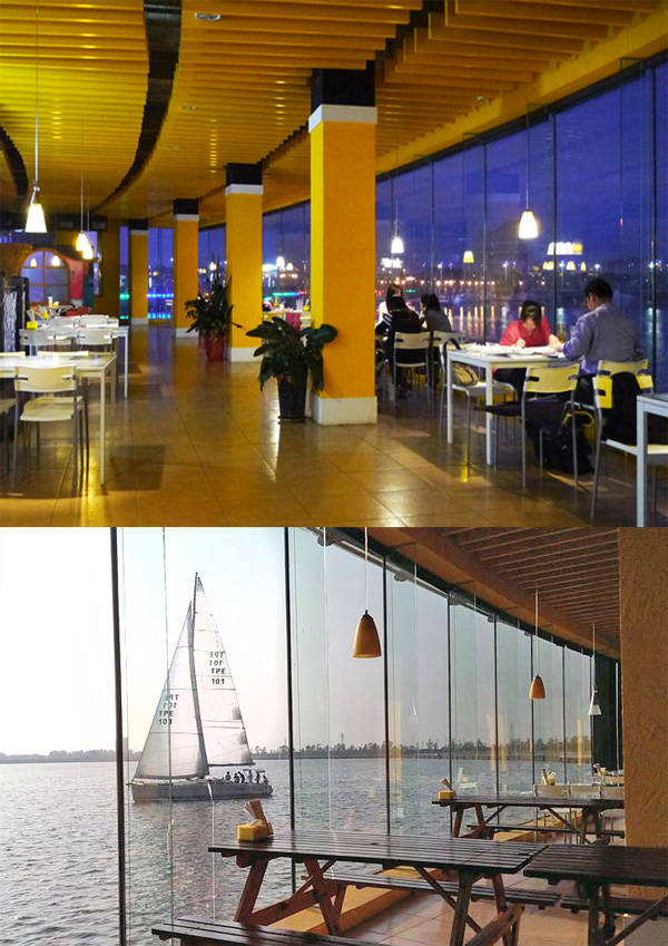 透過愛法蘿I-faro帆船主題餐廳的全帷幕玻璃可觀賞興達港日夜風景變化。(圖/李昀諭　攝、愛法蘿I-faro帆船主題餐廳　提供)